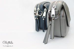 “Keva Mini Leather Crossbody bag” (Grey)